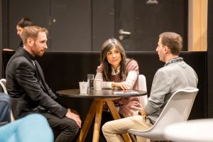 Three people talking